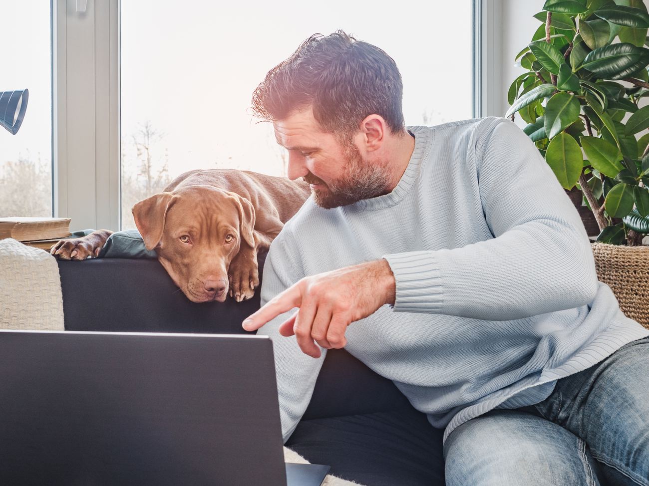 A veteran sharing a quiet, supportive moment with his puppy